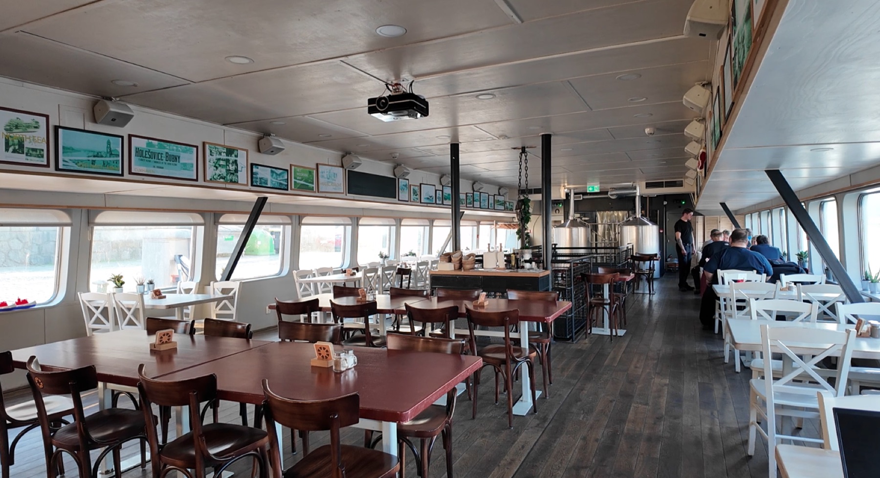 Main hall with boat windows and brewery tanks